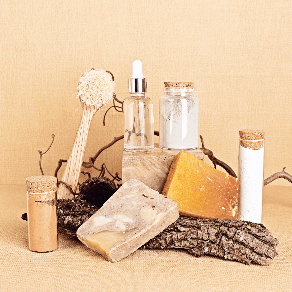 Natural skincare products arranged with wood and cork accents on a beige background.